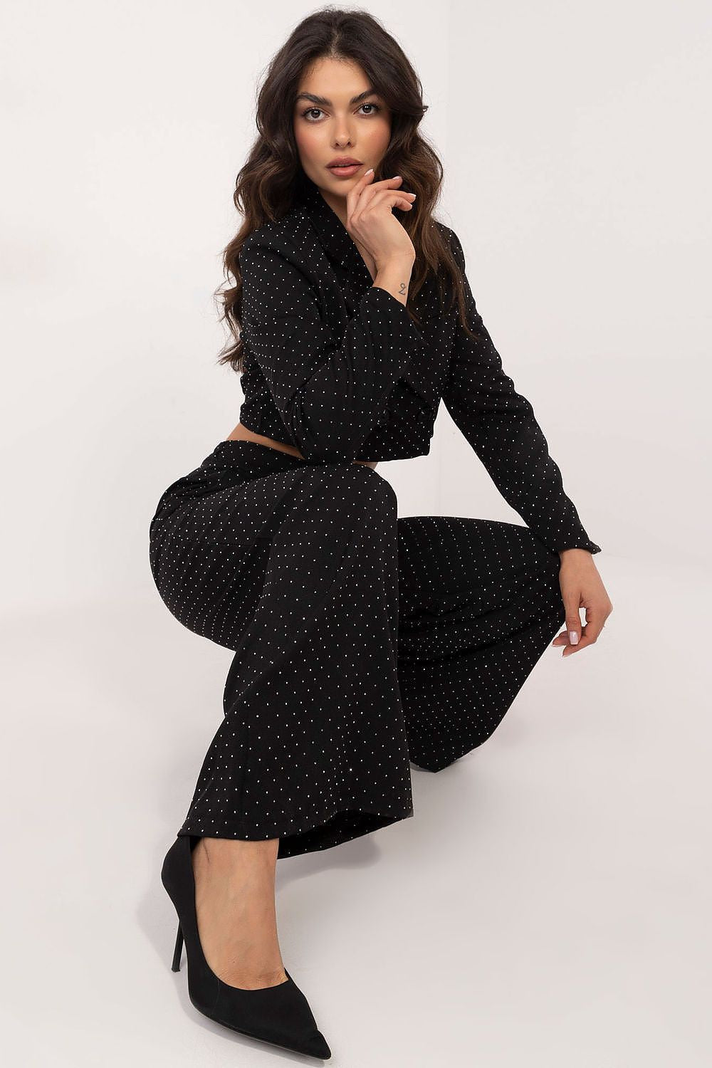 Elegant wide leg palazzo pants adorned with sequins by Italy Moda, perfect for formal occasions, showcasing a luxurious fit and sophisticated design.
