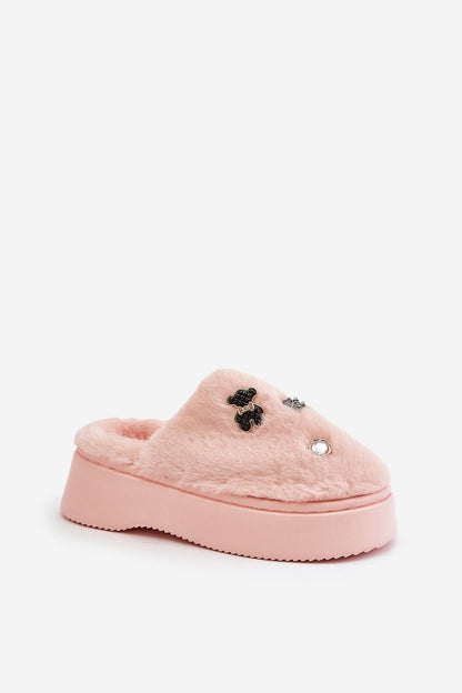 Elegant fur slippers with covered noses and charming pins, perfect for indoor relaxation or quick outdoor outings, from Step in Style.