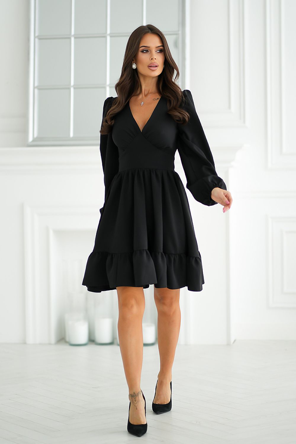 Close-up of Bicotone cocktail dress detailing, showcasing the delicate shoulder buffets and comfortable elastic cuffs.