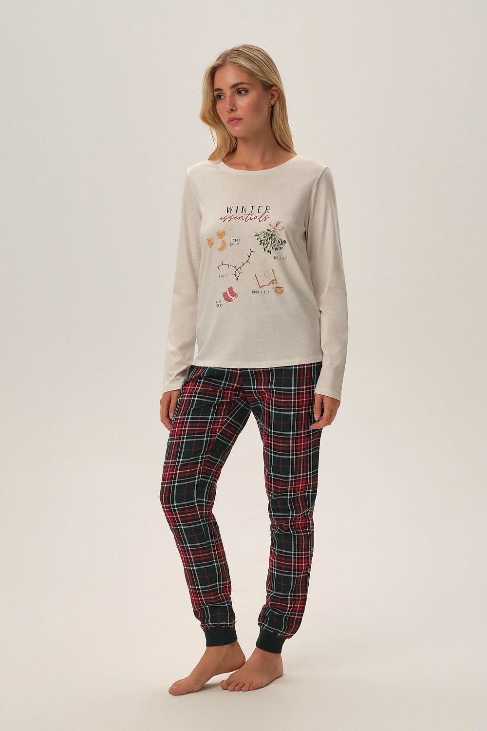 Luxurious Henderson Florencia Christmas Pyjamas featuring an elegant beige top with winter graphics and stylish checkered pants, available in sizes S to XXL for a comfortable festive experience.