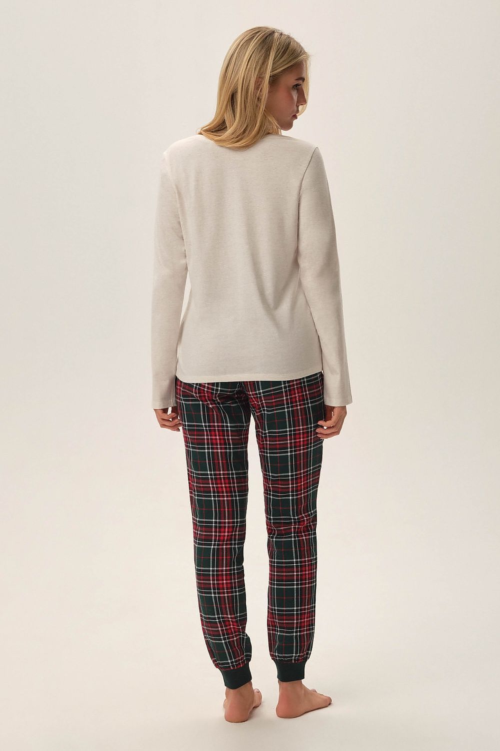 Elegant Henderson Florencia Christmas Pyjamas featuring a stylish beige top with winter graphic design and sophisticated checkered pants, available in sizes S to XXL for a luxurious and comfortable festive feel.