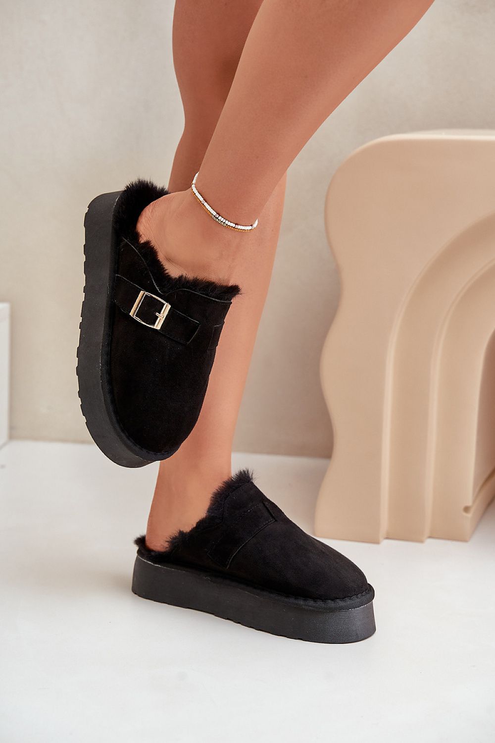 Comfortable and stylish fur-lined women's slippers by Step in Style, featuring a fashionable gold buckle and designed for EU sizes 36-41.