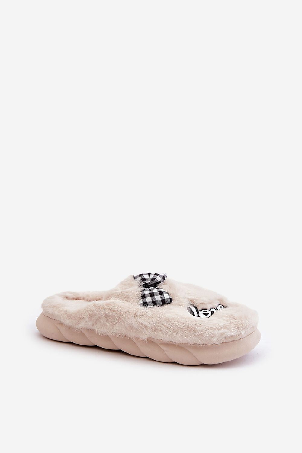 Step in Style's luxurious women's fur slippers with eye-catching patches and bow detailing, showcasing both elegance and warmth.