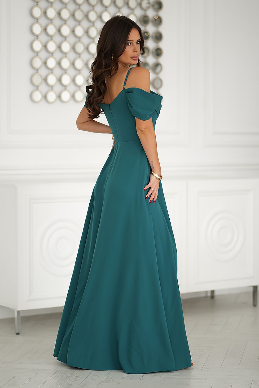 Bicotone's luxurious maxi dress featuring a romantic side slit and soft shoulder straps, designed to flatter every figure with its flowing elegance.