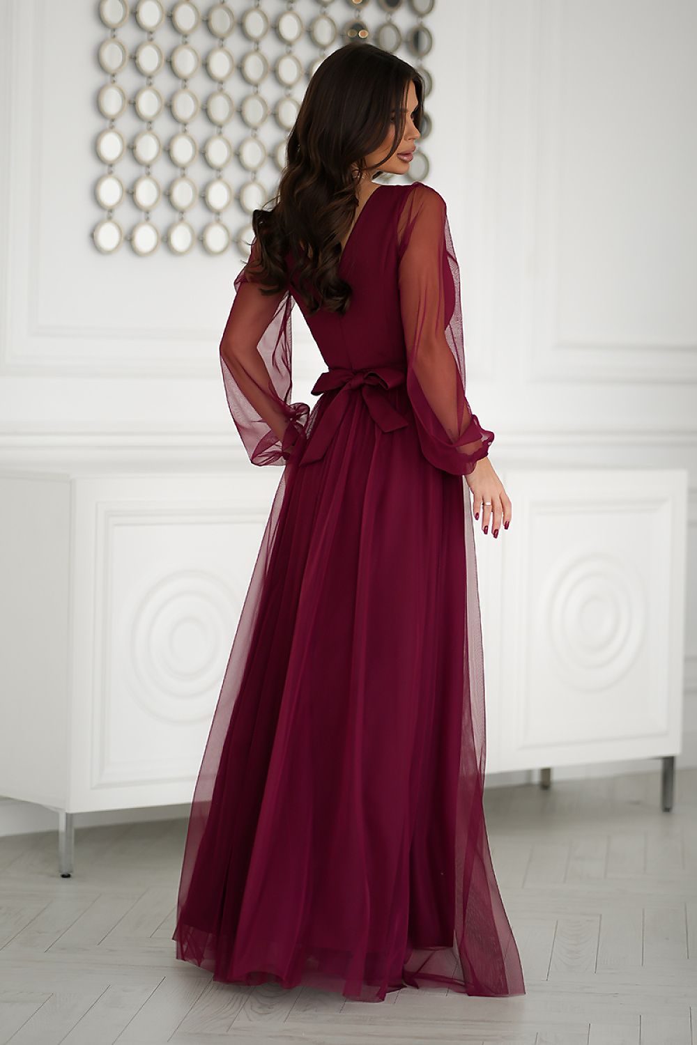 Fashionable Bicotone long dress in sizes EU 34-46, designed with an elegant silhouette and stylish belt accent.