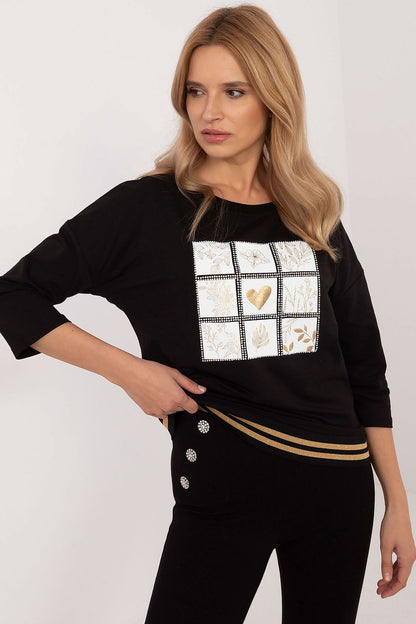 Close-up of rhinestone embellishments on a chic blouse by Factory Price, blending elegance and everyday wear with a cotton and spandex composition.