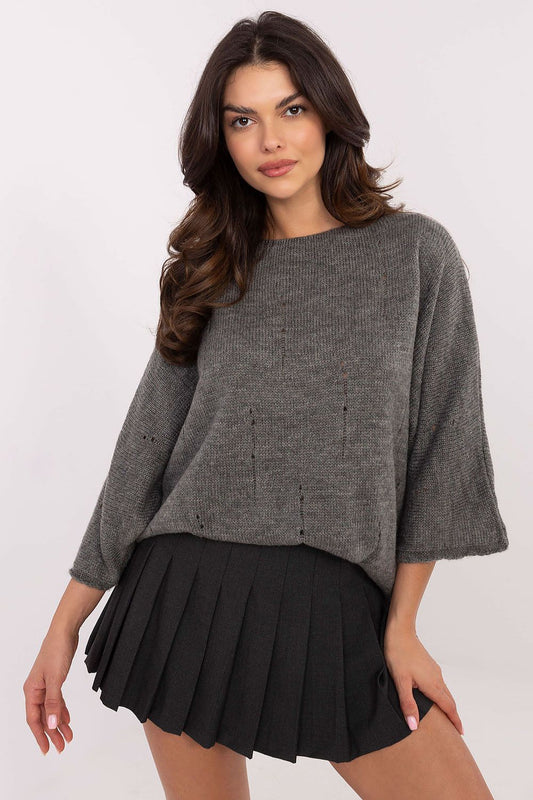 Trendy oversized sweater by Italy Moda showcasing a unique style, made from a luxurious blend of acrylic, wool, polyamide, and viscose. The smooth pattern and subtle holes highlight its chic design, perfect for women's casual or office wear.