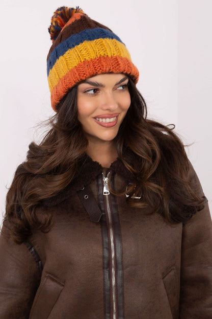 Chic beanie cap by AT adorned with lively stripes and a soft pom-pom, a must-have accessory for cold weather.