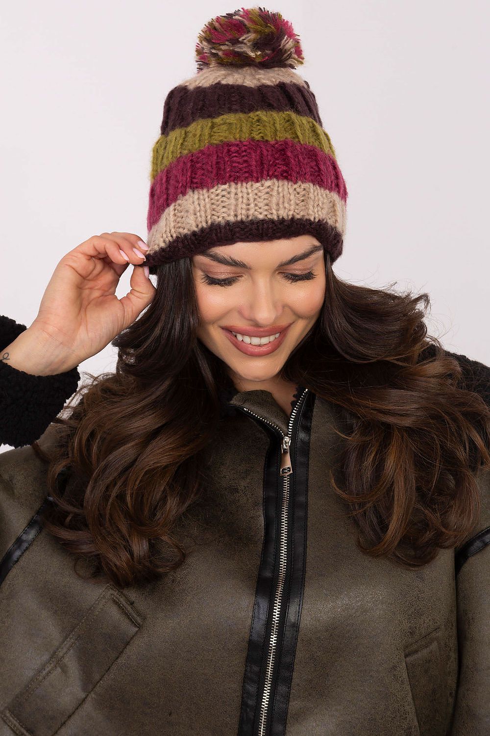 Stylish winter beanie cap by AT, showcasing colourful stripes and a chic fluffy pom-pom for added elegance.