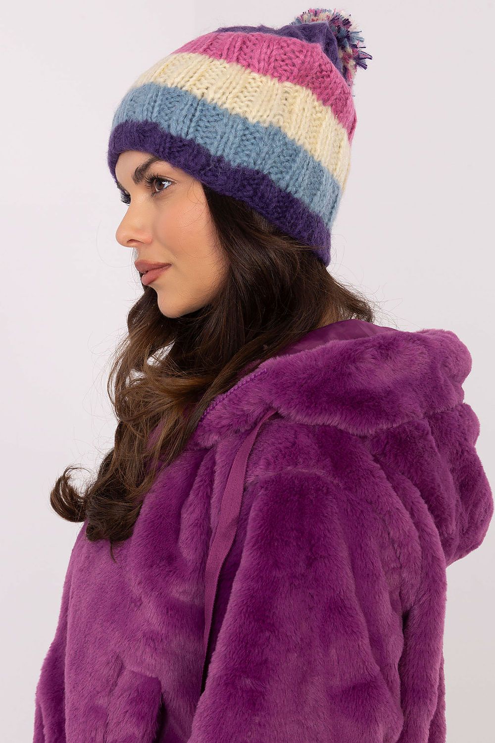 Trendy winter beanie cap by AT featuring a stylish striped pattern and plush pom-pom, perfect for all head sizes.