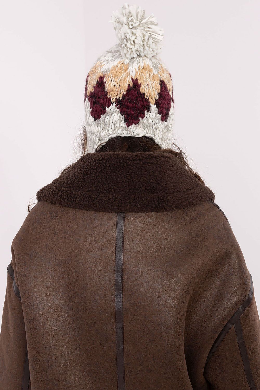 Warm and chic ear hat for women, featuring a unique geometric pattern, crafted by AT for ultimate winter style.