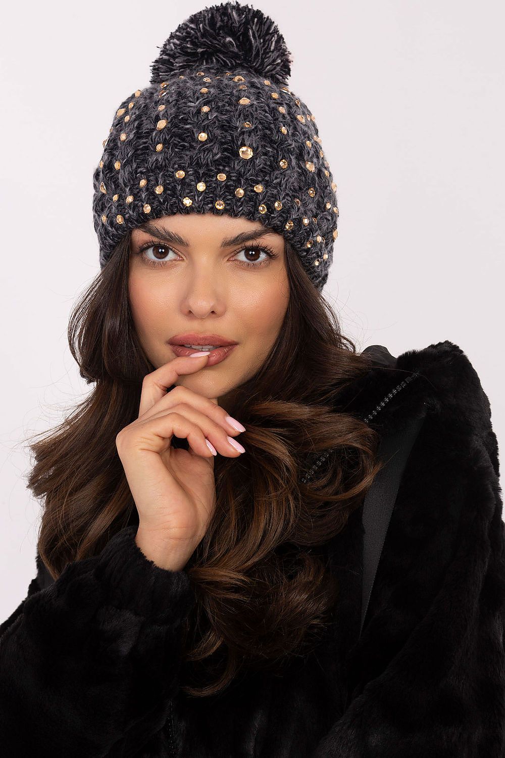 Elegant women's beanie by AT featuring a fluffy pom-pom and sparkling zircon accents, perfect for winter warmth and fashionable style.