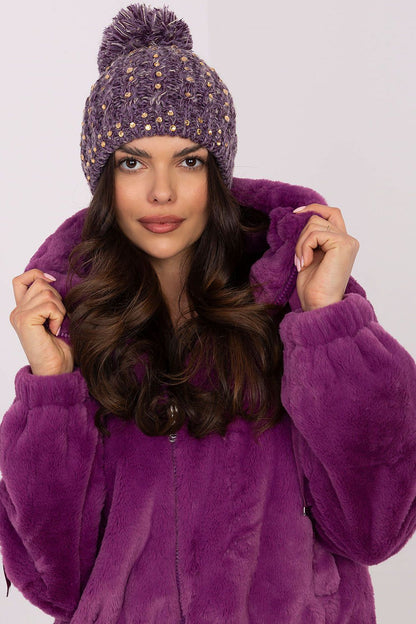 Stylish winter beanie cap for women by AT with a luxurious touch, featuring a fluffy pom-pom and sparkling zircon decor, perfect for winter elegance.