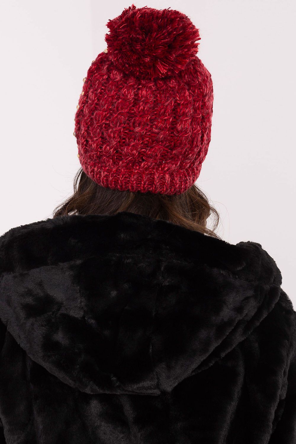 Warm and stylish beanie for women by AT, adorned with a fluffy pom-pom and delicate zircon details, perfect for cold weather.