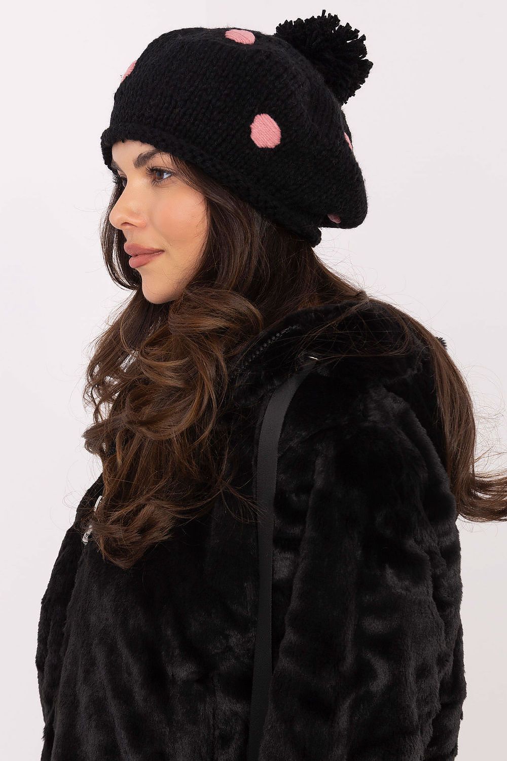 AT's luxury women's beanie hat, adorned with a fluffy pom-pom and decorative dots, designed for style and warmth, made from soft acrylic fabric, ideal for winter fashion.