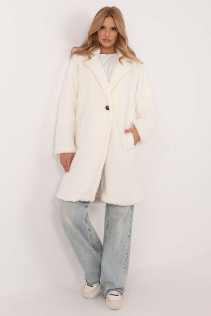 Elegant winter coat by Italy Moda showcasing a lightweight, classic pre-knee length design in a stylish setting, ideal for everyday wear.