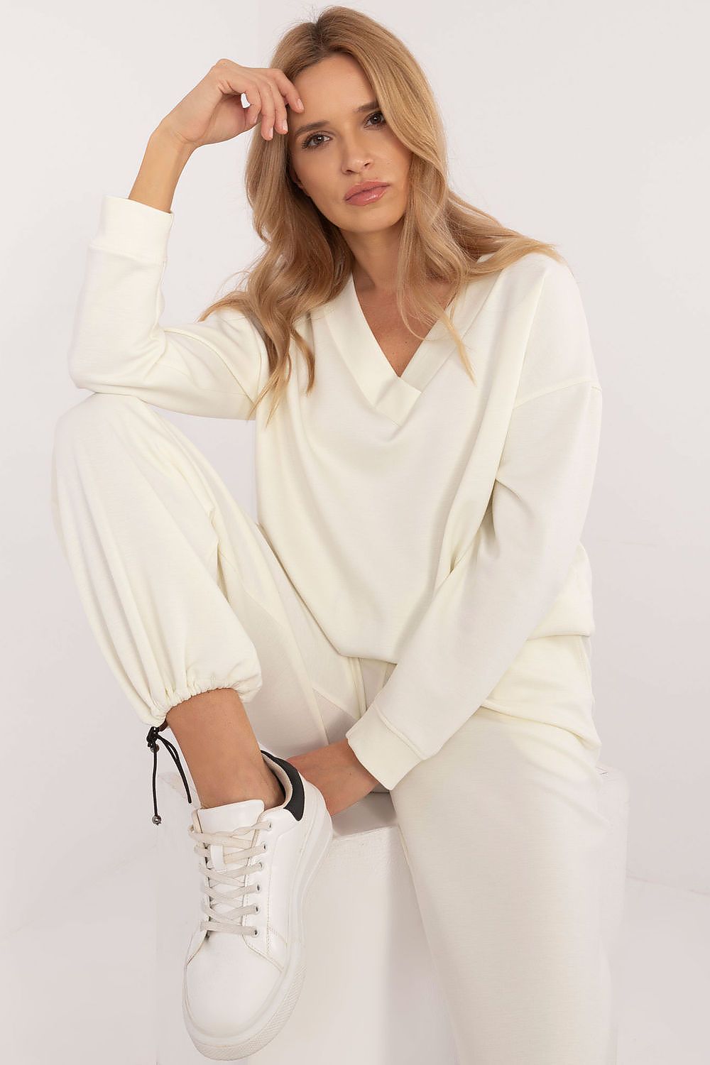 Elegant high-waisted pants with tapered legs from Lakerta's luxurious casual sweatshirt set for women, designed for comfort and style with practical side slip pockets.