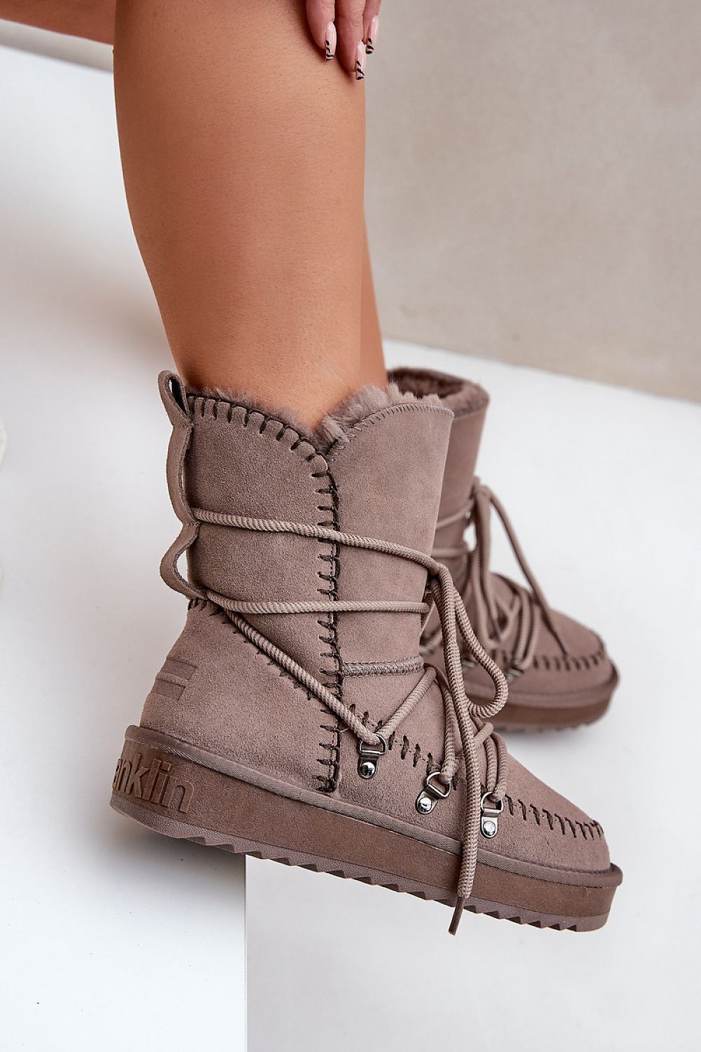 Elegant and warm women's snow boots by Step in Style, showcasing a unique asymmetrical upper, perfect for chic winter outfits with added functionality.