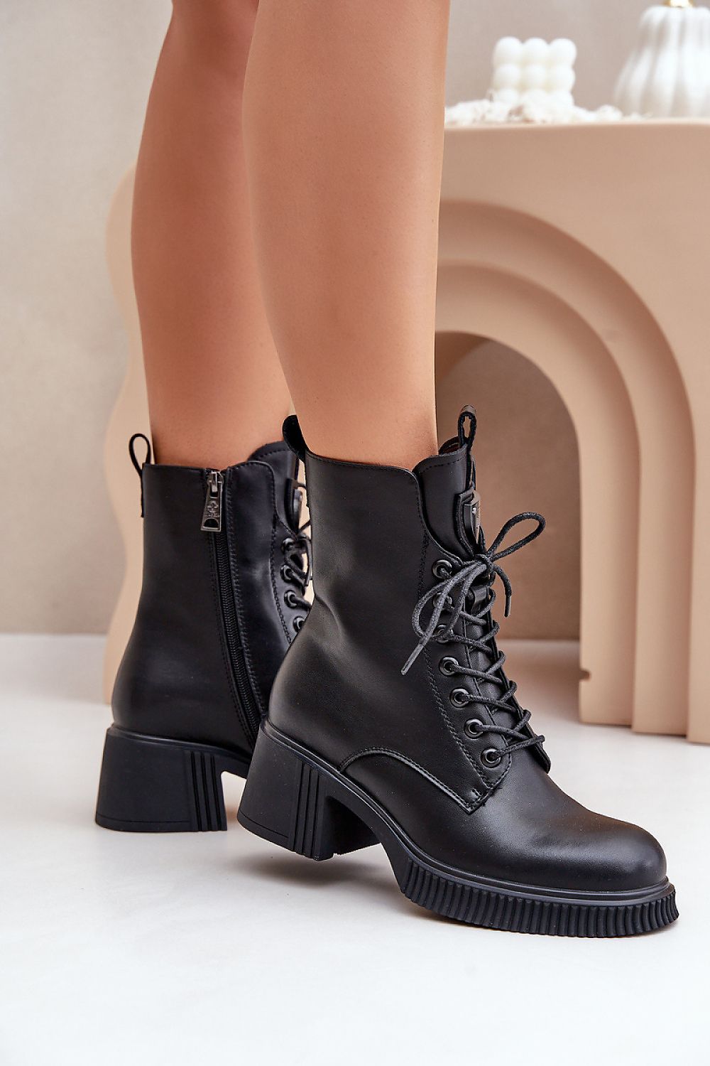 Elegant genuine leather women's ankle boots by Step in style featuring a stylish zipper and lace fastening, set on a 6cm heel, perfect for a chic autumn-winter wardrobe.