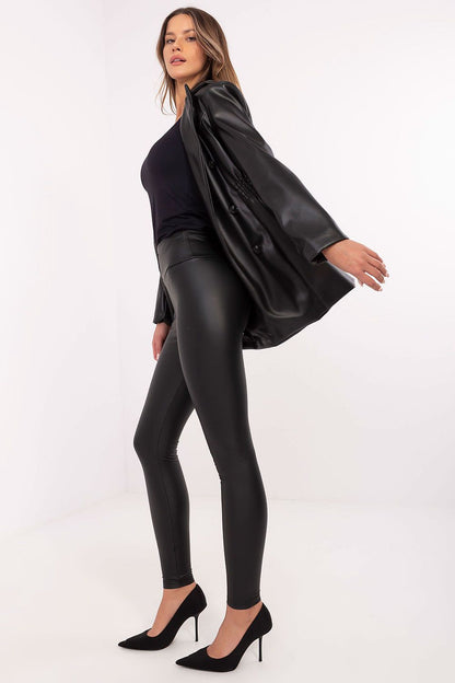 Stylish women's eco-leather leggings featuring a smooth texture and delicate front embroidery by NM, perfect for creating sophisticated outfits.