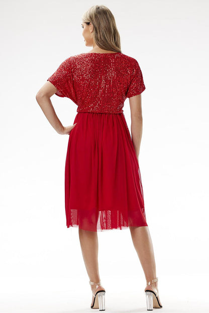 Elegant Awama kimono evening dress adorned with sequins and tulle, showcasing a luxurious silhouette ideal for special occasions.