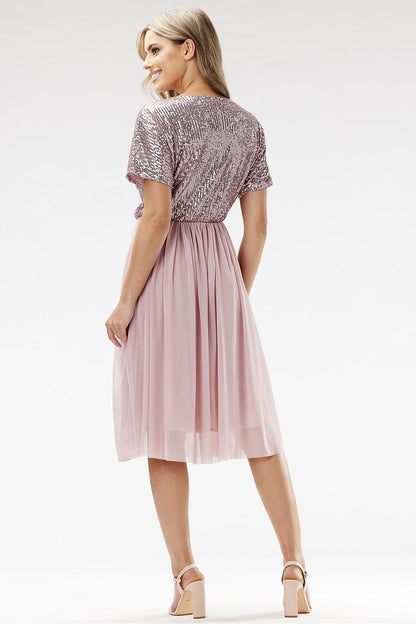 Back view of the Awama evening dress featuring a flowing tulle design, embracing elegance and sophistication for evening outings.