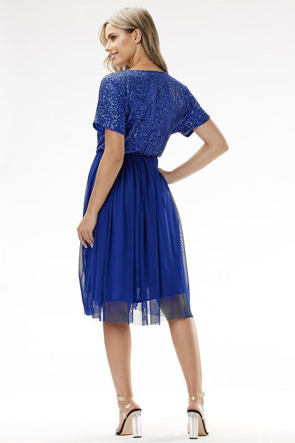 Close-up of the luxurious sequins on the Awama kimono evening dress, highlighting its elegant design and opulent materials.