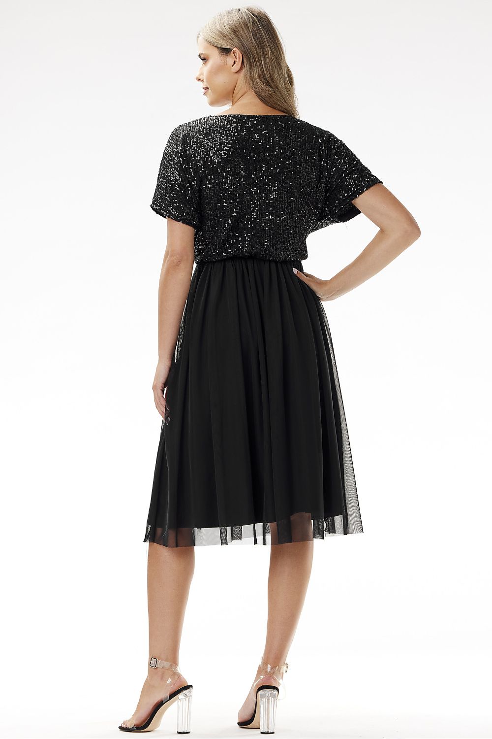 Detailed view of the tulle fabric of the Awama kimono evening dress, illustrating its delicate texture and luxurious appeal.