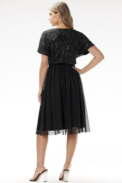 Detailed view of the tulle fabric of the Awama kimono evening dress, illustrating its delicate texture and luxurious appeal.