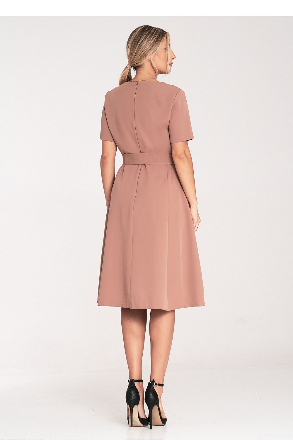 Model wearing the Figl classic midi dress in a stylish pose, highlighting the flattering boat neckline and sophisticated silhouette.