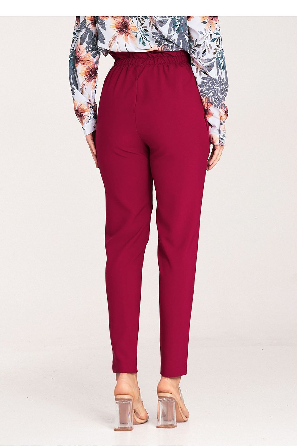 Model wearing elegant Figl trousers with gold buckle, exemplifying contemporary luxury and chic style for women.