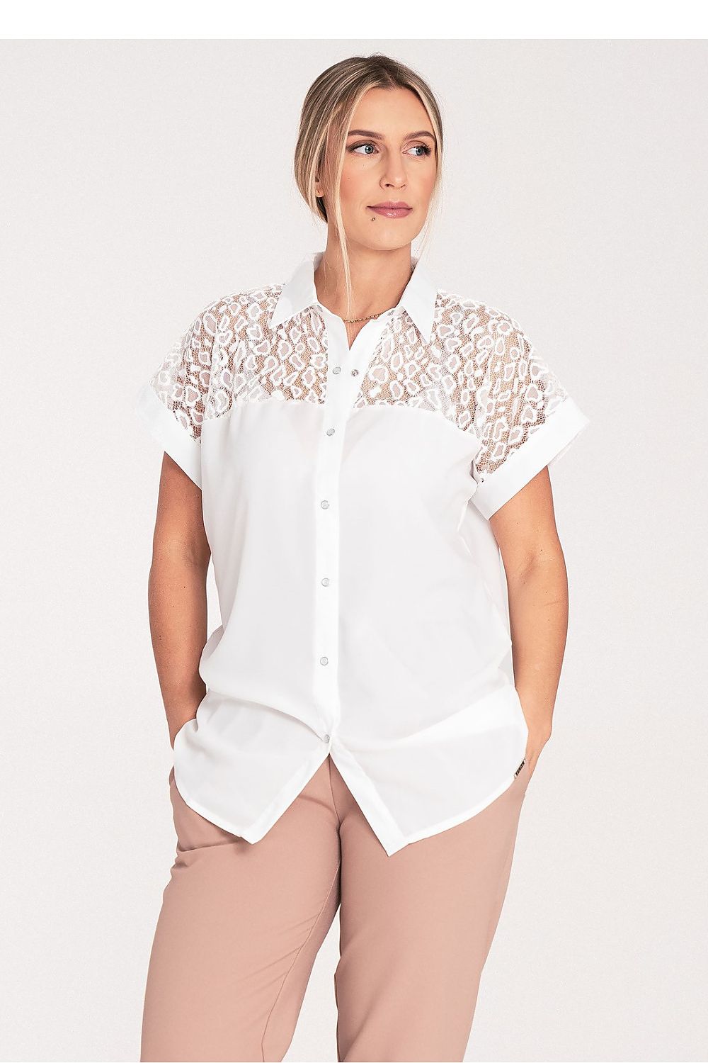 Close-up of Figl buttoned short sleeve shirt, featuring intricate mottled texture and luxurious fabric.
