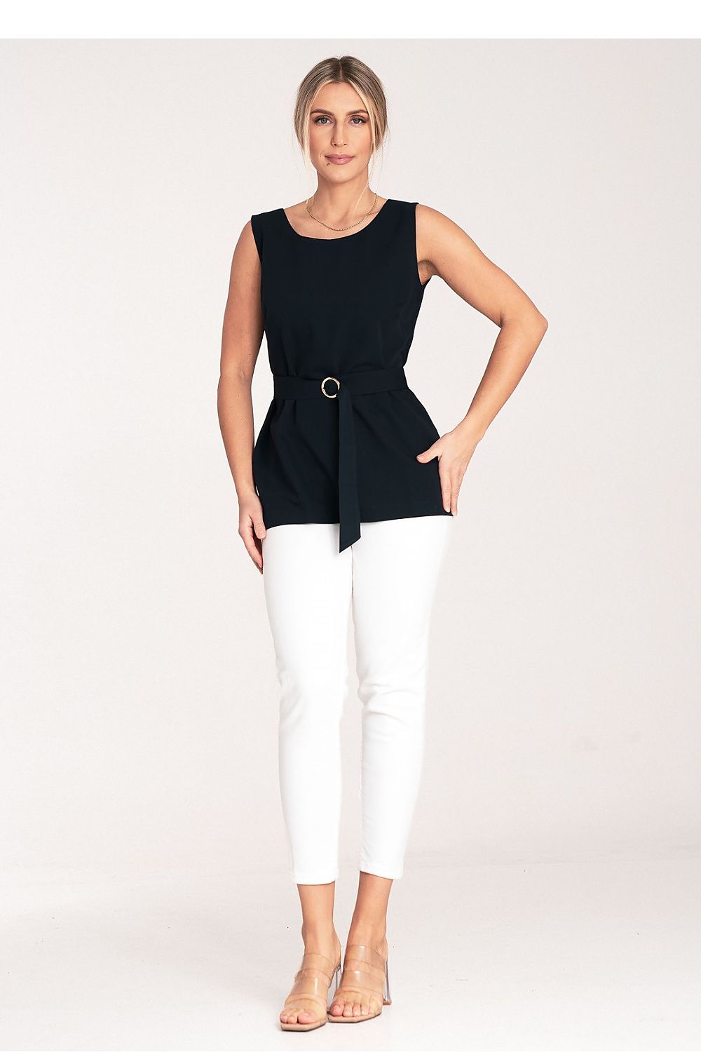 Close-up of the Figl blouse, highlighting the exquisite fabric and chic boat neckline, perfect for elegant occasions.