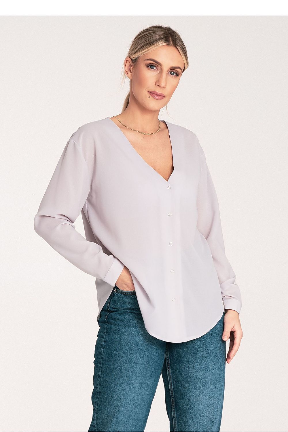 Model wearing Figl long sleeve shirt with a cheeky neckline and elegant design, ideal for fashion-forward individuals.