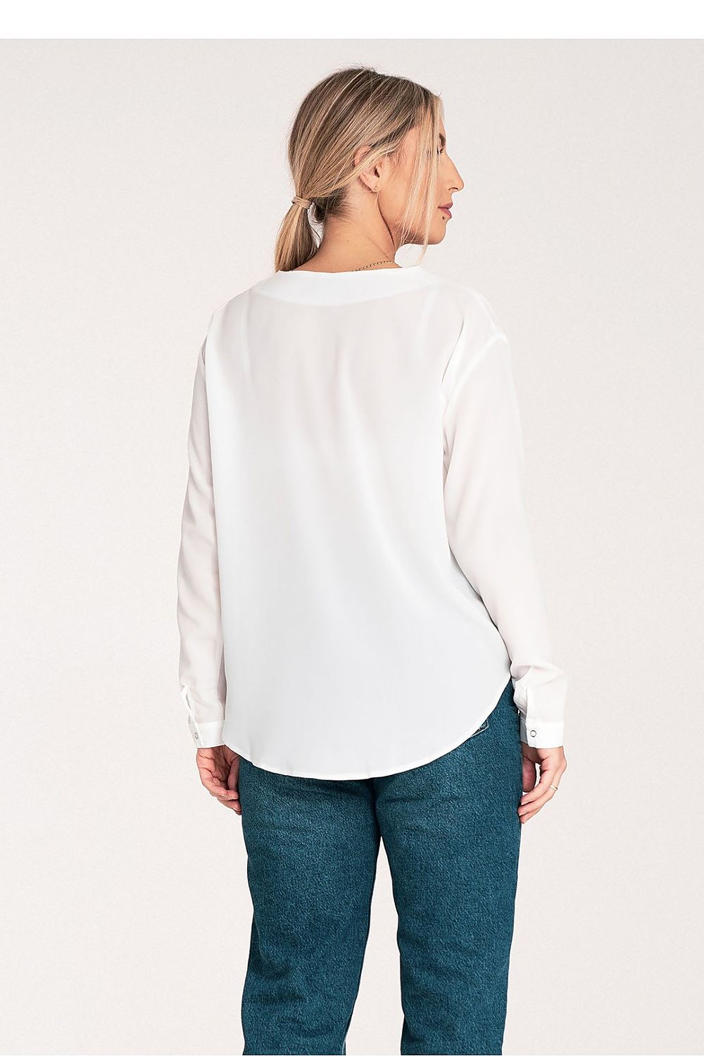 Fashion-forward Figl long sleeve shirt on model, displaying the flattering cheeky neckline and perfect fit for a sophisticated ensemble.