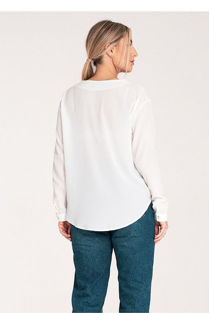 Fashion-forward Figl long sleeve shirt on model, displaying the flattering cheeky neckline and perfect fit for a sophisticated ensemble.