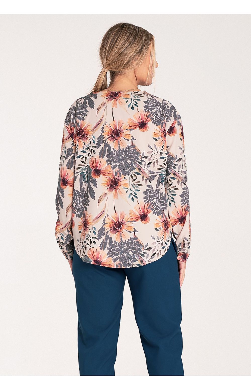 Luxury Figl long sleeve shirt laid flat, highlighting its elegant cut and fashionable cheeky neckline for modern style.