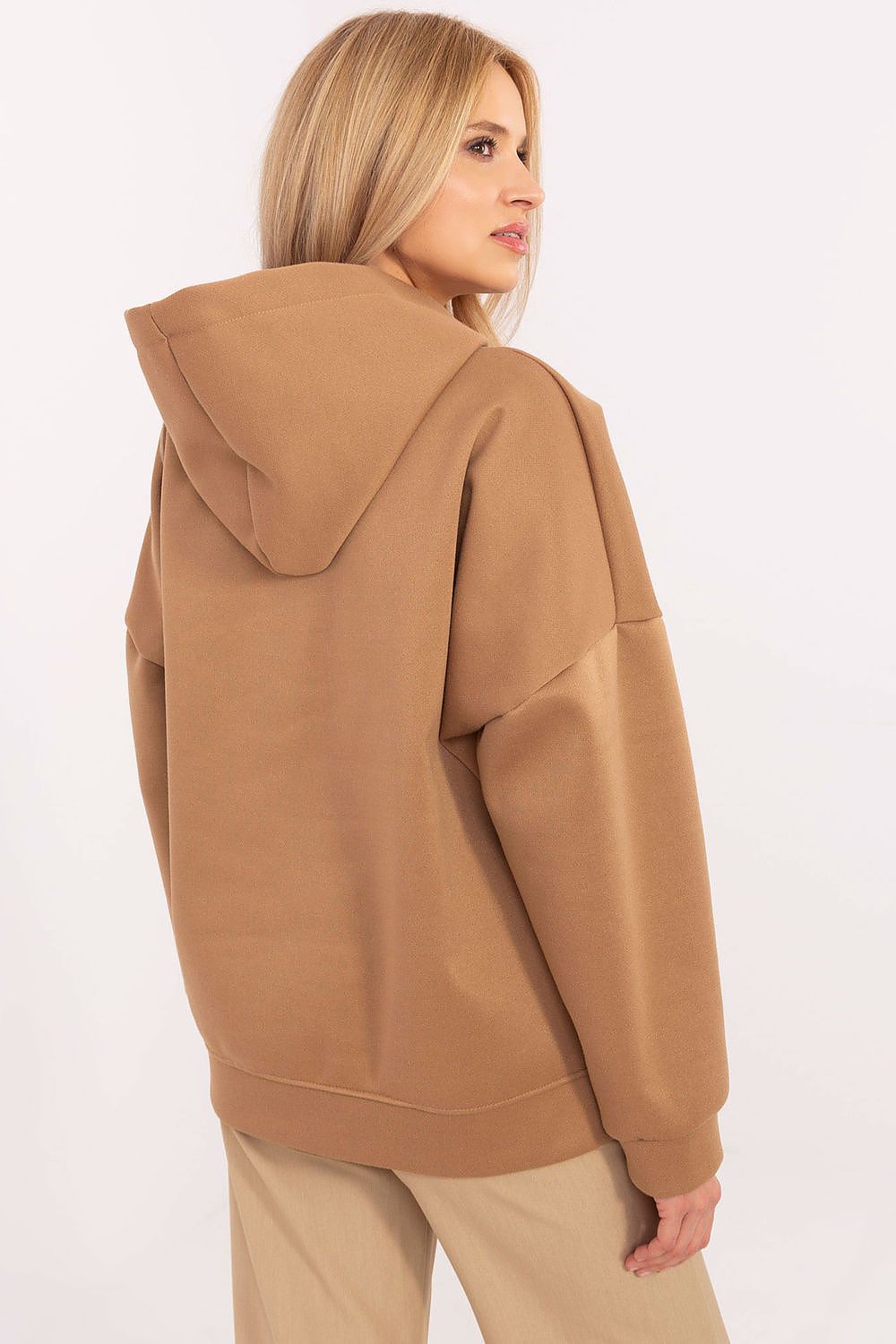 Model wearing Italy Moda's Luxury Women's Casual Sweatshirt with hood and teddy bear patches, perfect for adding charm and comfort to casual outfits.