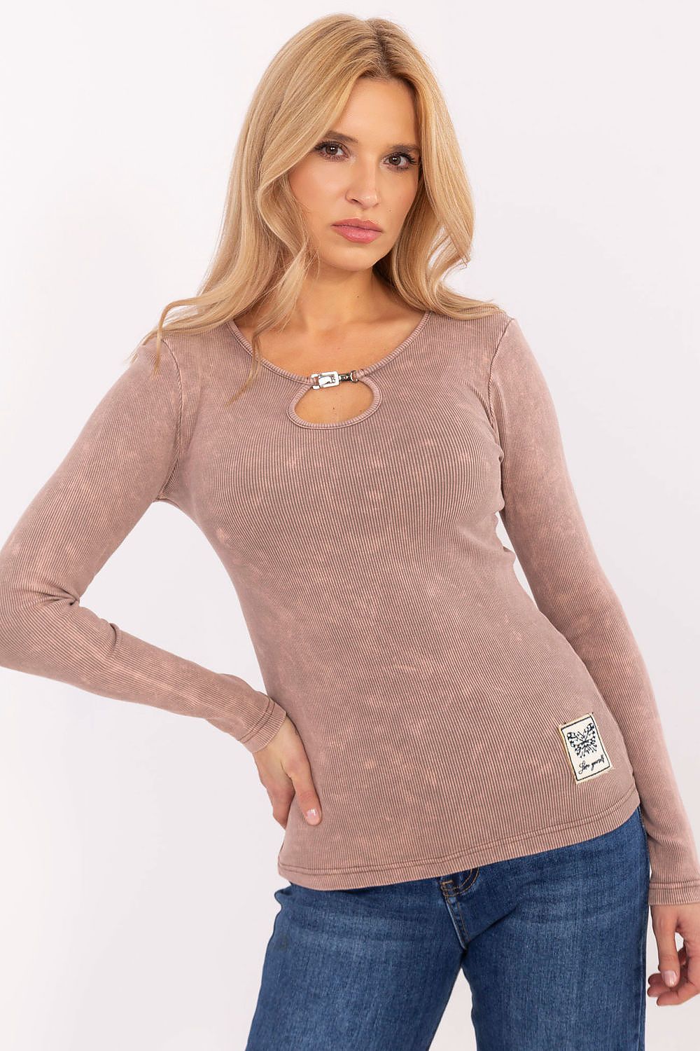 Detail shot of the patch on the Factory Price long sleeve blouse, emphasising the blend of comfort and style for a luxurious casual wardrobe.