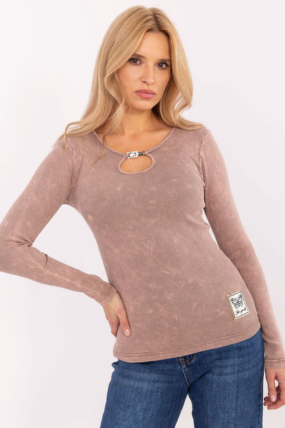 Detail shot of the patch on the Factory Price long sleeve blouse, emphasising the blend of comfort and style for a luxurious casual wardrobe.