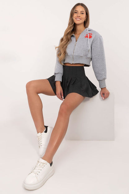 Women's casual sweatshirt with long sleeves and modern prints, displayed in a stylish setting by Factory Price, epitomising luxury leisurewear.