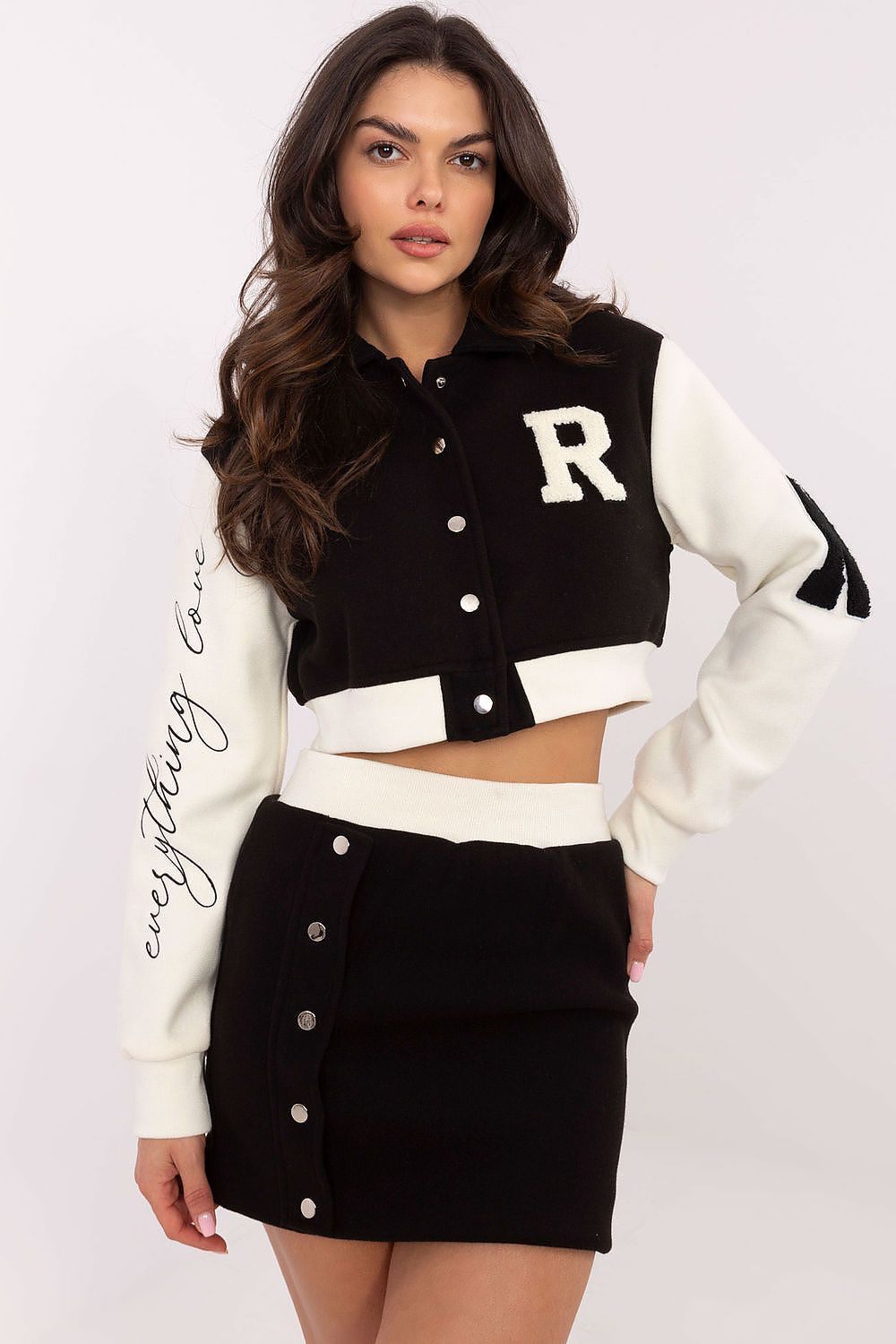 Model wearing NM's elegant women's casual style set, highlighting the modern polyester blouse and skirt, perfect for versatile styling.