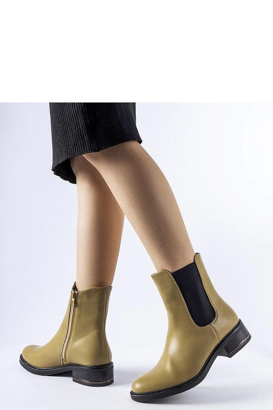 Stylish olive ankle boots Bagnoro by Solea, featuring a flat heel and round toe design, ideal for both casual and formal looks during winter.