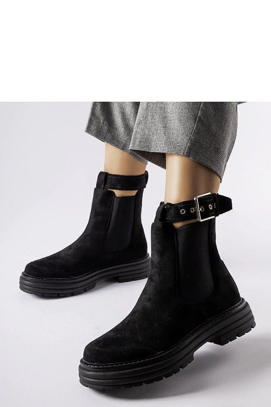 Close-up of Solea Abela ankle boots in eco-friendly leather featuring decorative fastening, ideal for both casual and formal wear.