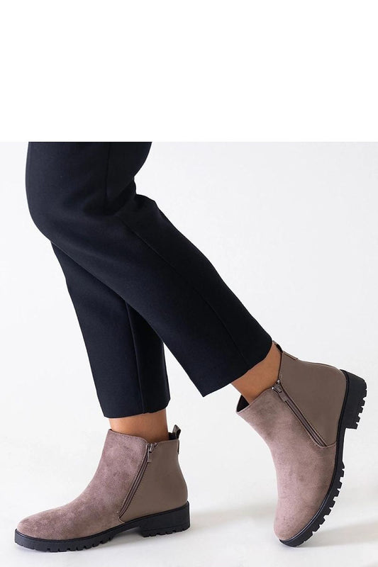 Chic interior view of Solea black eco-suede ankle boots highlighting the insulated lining and zip closure for easy wear and a sophisticated look.