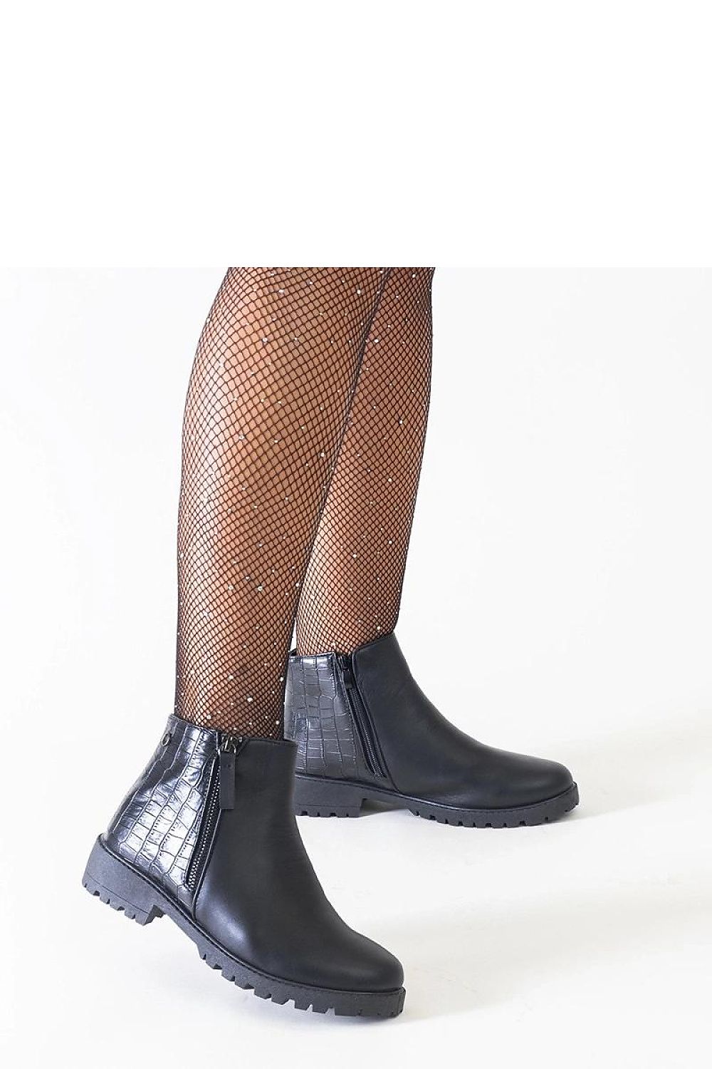 Stylish display of Solea black eco-suede ankle boots, showcasing their durable construction and flexible rubber sole for confident strides.