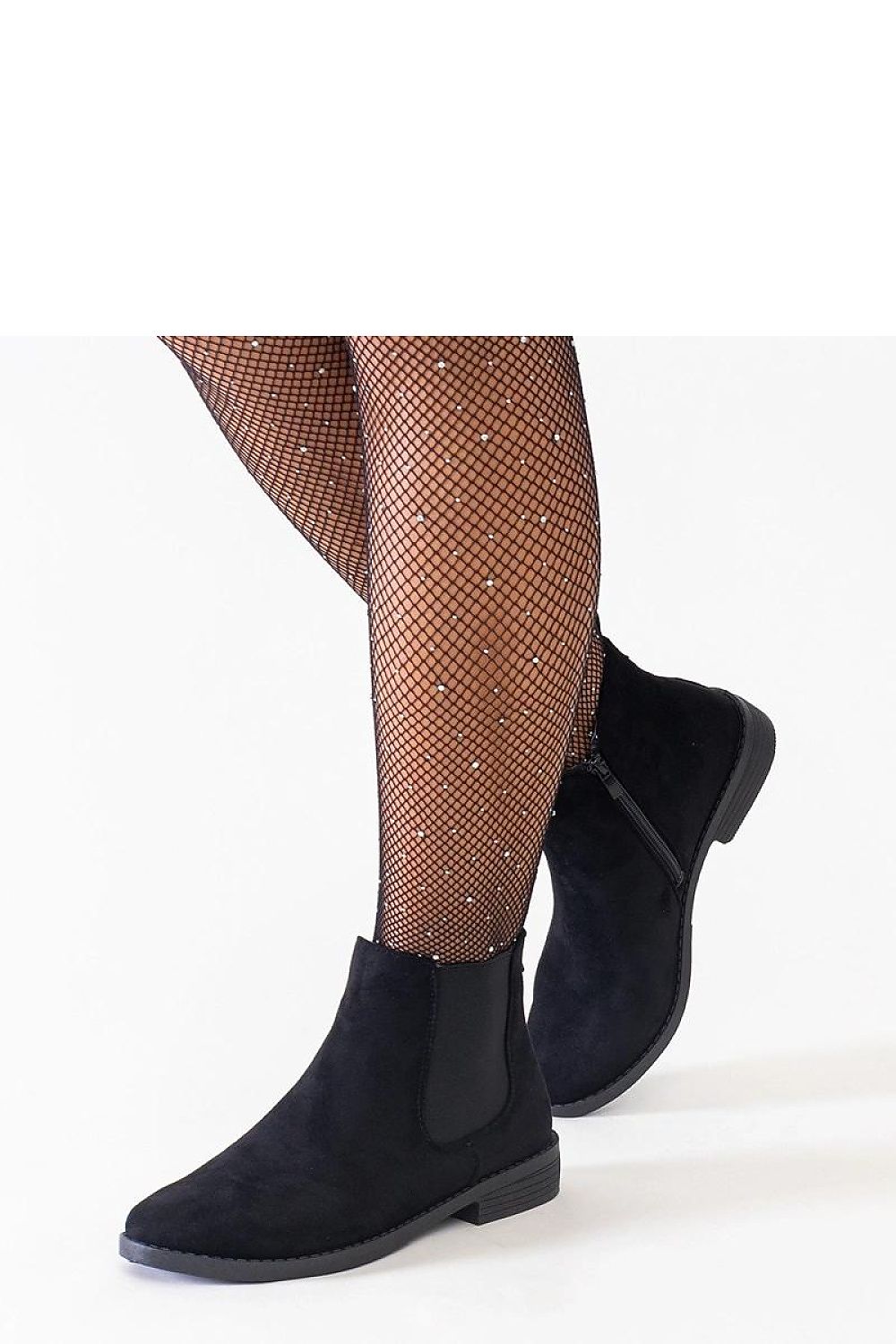 Close-up of Solea eco-suede ankle boots showcasing the almond toe and flat heel for stability and style.