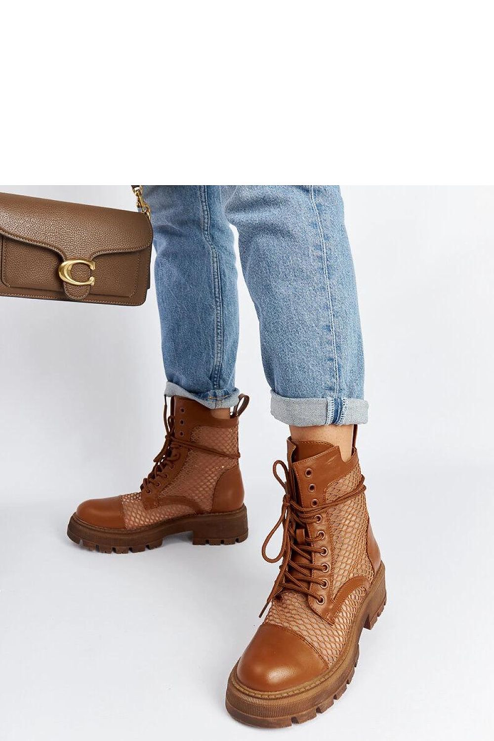 Chic design of Solea Brown Translucent Waldeck Trappers showcasing high ankle style and laced fastening for a tailored fit.