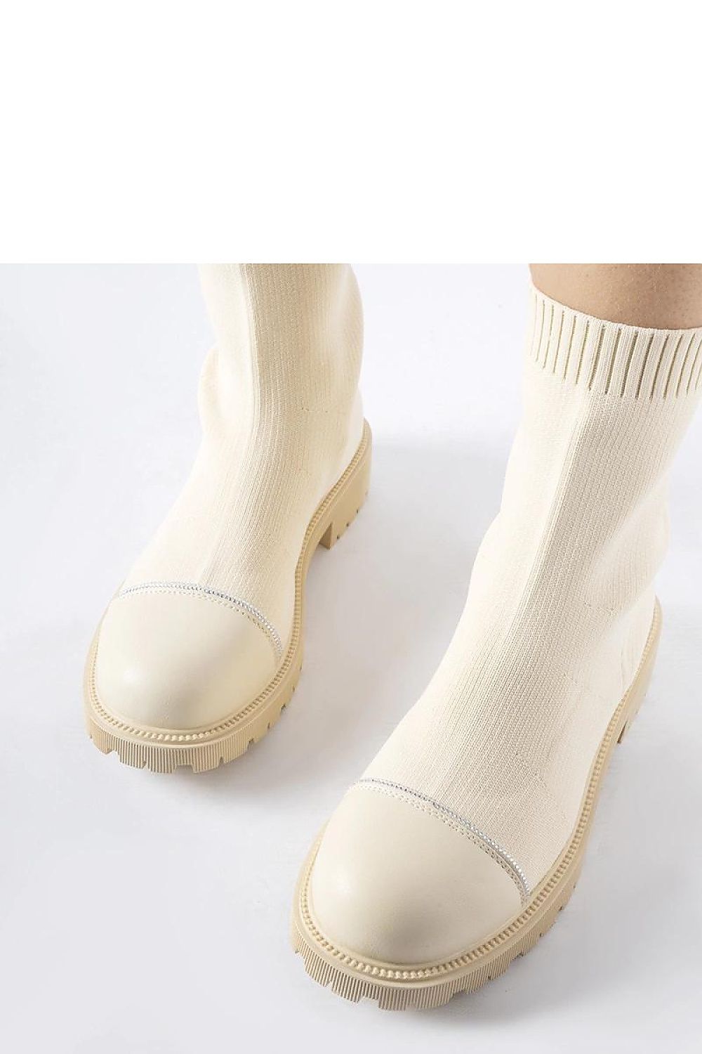 Close-up view of Solea luxurious beige sock boots featuring sparkling Vail zircons, perfect for adding a touch of elegance to both casual and formal outfits.