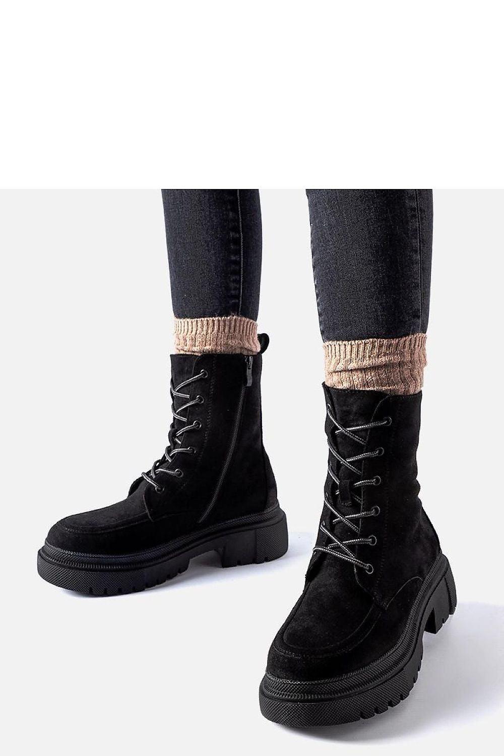 Stylish ensemble featuring Solea black eco leather trapery boots, exemplifying luxury and warmth for chilly seasons.